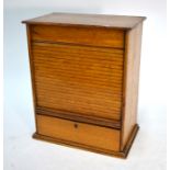 A Victorian oak desk-top stationery cabinet with tambour fall-front and fitted lower drawers, 36 x