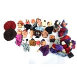 A collection of vintage composite puppet-heads with cloth bodies, some a/f