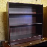 A stained open bookcase with two adjustable shelves