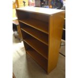 A light teak open bookcase with three adjustable shelves