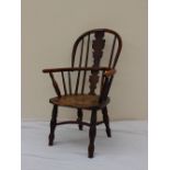 A 19th century child's Elm and Yew Windsor chair,