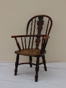 A 19th century child's Elm and Yew Windsor chair,