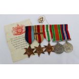 A set of World War II medals, including the 1939-1945 Star,
