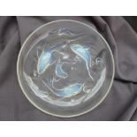 An opalescent glass bowl in the Lalique style decorated with fish, waves and air bubbles,