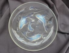 An opalescent glass bowl in the Lalique style decorated with fish, waves and air bubbles,