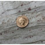 An Elizabeth II gold sovereign dated 2017,