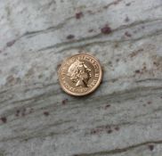 An Elizabeth II gold sovereign dated 2017,