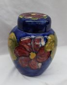 A Moorcroft pottery Ginger Jar and cover, decorated in the Clematis pattern to a blue ground,