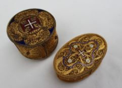 A gilt wire work box and cover of oval form, with enamel decorated of a cross,