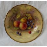 A Royal Worcester porcelain dished plate of circular ogee form, painted with still life of peaches,