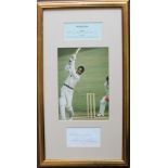Sir Gary Sobers a signed sheet beneath an action colour photograph, with statistical details,