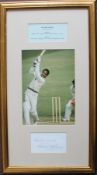 Sir Gary Sobers a signed sheet beneath an action colour photograph, with statistical details,