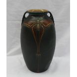 A Mobach pottery twin handled vase, decorated with a butterfly, to a dark green ground,