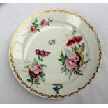 A Swansea porcelain plate painted with sprays of flowers to a gilt husk border,