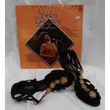 Shirley Bassey - a pair of Sona Rykiel black suede and gilt metal mounted Lady's shoes,