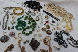 Assorted costume jewellery including simulated pearls, bead necklaces, brooches,