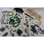 Assorted costume jewellery including simulated pearls, bead necklaces, brooches,