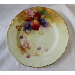 A Royal Worcester porcelain plate painted with blackberries and leaves to an ivory ground,