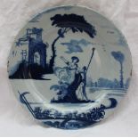 An 18th century Bristol Delft plate with blue painted decoration of a maiden in front of a ruin,