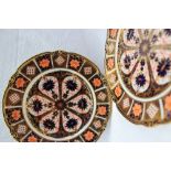 A pair of Royal Crown Derby 8706 Imari palette porcelain plates, with a scalloped edge in reds,