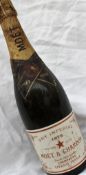A bottle of Moet & Chandon dry imperial champagne 1975