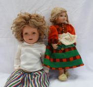A Shirley Temple doll, by |Ideal, with curly blond hair closing eyes and open mouth with teeth,