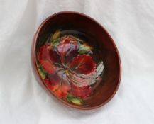 A Moorcroft pottery flambe bowl, decorated in the hibiscus pattern, impressed mark, 15.