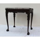 A George III style mahogany silver table with a spindle gallery,