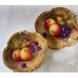 A pair of Royal Worcester porcelain lobed dishes painted with apples,