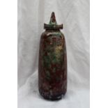 A Cobridge stoneware vase and cover, in red and green glaze, impressed mark,