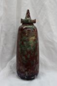 A Cobridge stoneware vase and cover, in red and green glaze, impressed mark,