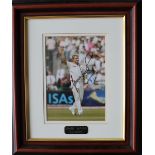 Shane Warne a signed colour photograph with plaque to the base "Shane Warne, Genius",