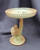 A Royal Worcester porcelain tazza, the pierced bowl transfer and infil decorated with flowers,