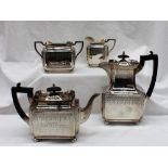 An Edward VII silver four piece teaset, of rectangular form decorated with swags,