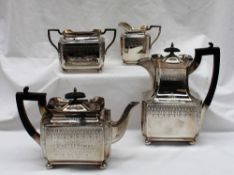 An Edward VII silver four piece teaset, of rectangular form decorated with swags,