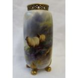 A Royal Worcester porcelain vase of cylindrical form with a reticulated top on four leaf capped