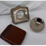 A George V silver desk clock, Birmingham, 1914, set with a goliath pocket watch,
