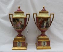 A pair of Vienna Style twin handled vases and covers, with a domed cover with gilt finial,