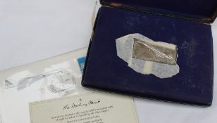 A Danbury Mint silver ingot produced to mark the inauguration of the Concorde age of supersonic