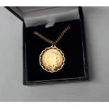 An Elizabeth II gold sovereign dated 2001, in a 9ct gold mount on a 9ct chain,