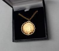An Elizabeth II gold sovereign dated 2001, in a 9ct gold mount on a 9ct chain,