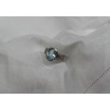 An 18ct white gold aquamarine and diamond dress ring,