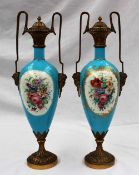 A pair of Sevres style porcelain and ormolu mounted twin handled vases and covers,