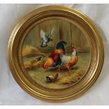A Francis Clark porcelain plaque of circular form painted with a cockerel and chickens,
