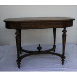 A 19th century French walnut centre table with a shaped top on four tapering legs United by a