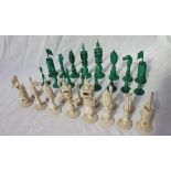 A 19th century Anglo Indian ivory chess set, one side natural, the other stained green,