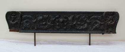 An 18th century carved pine panel, decorated with sea creatures,
