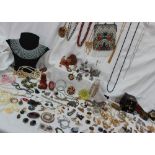 A large quantity of costume jewellery, including bracelets, brooches, earrings,
