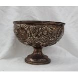 A late Victorian Silver pedestal rose bowl, embossed with flower heads and leaves,
