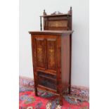 An Edwardian rosewood music cabinet,